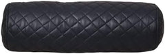 Black quilted cylindrical pillow with diamond pattern