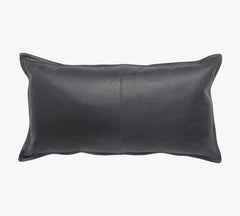 A rectangular black leather lumbar pillow with a smooth texture and a central seam, shown against a plain white background.