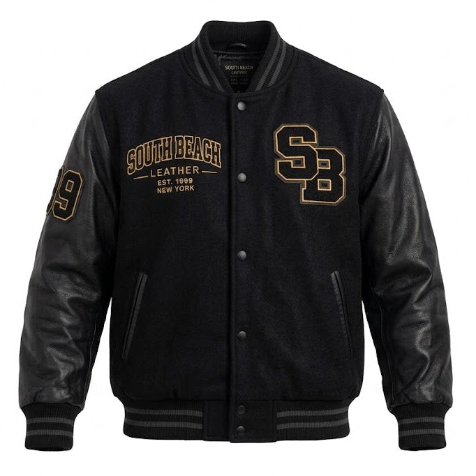 A black varsity-style jacket with black leather sleeves and black ribbed trim, featuring gold embroidered 'South Beach Leather' text and 'SB' lettering on the chest, and a gold number 9 on the sleeve.
