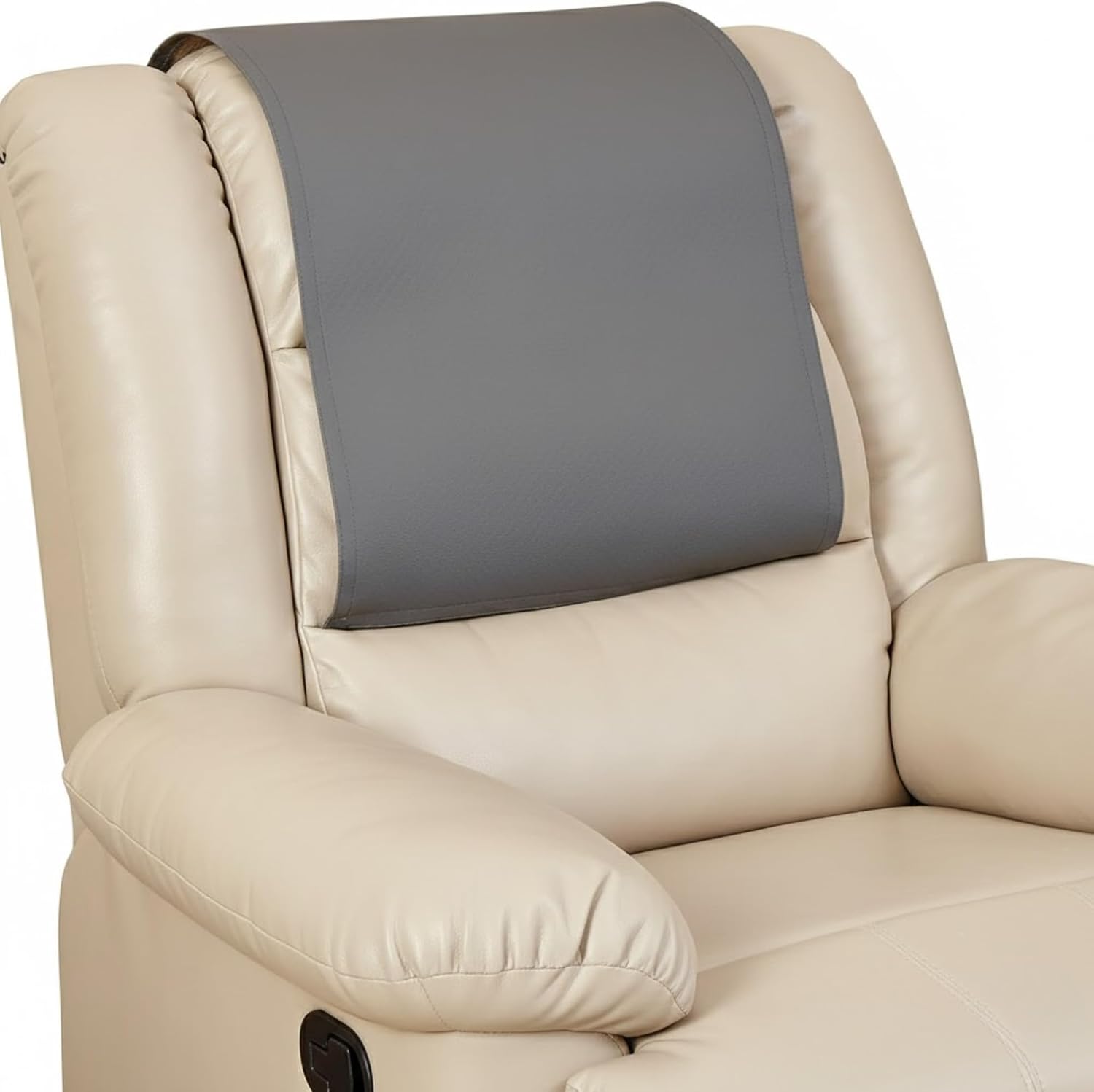 A close-up of a beige leather recliner chair with a dark gray headrest support pillow attached to the backrest.