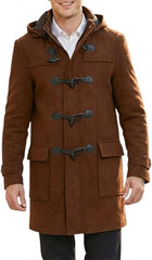 A man wearing a brown hooded duffle coat with dark toggle closures over a white collared shirt, shown against a plain white background.