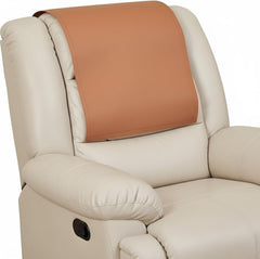 A close-up of a cream-colored leather recliner chair with a tan leather headrest cover or neck pillow insert, shown against a plain white background.