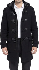 A man wearing a black hooded duffle coat over a white collared shirt and dark trousers, shown from the neck down against a plain white background.