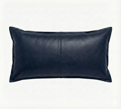 A dark navy blue leather lumbar pillow with a central seam, shown against a plain white background.