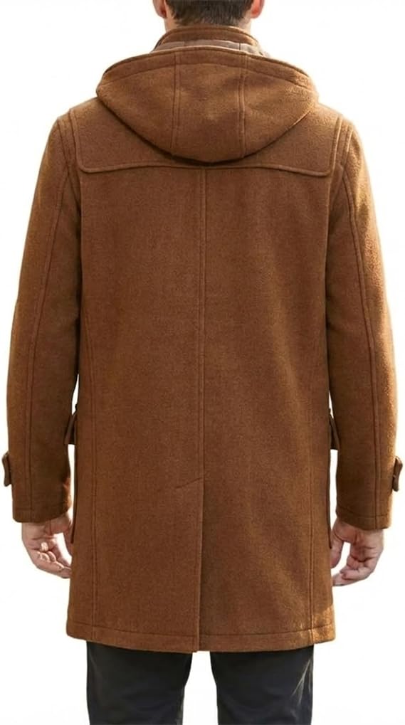 A man viewed from the back wearing a brown hooded coat over dark trousers, against a plain white background.