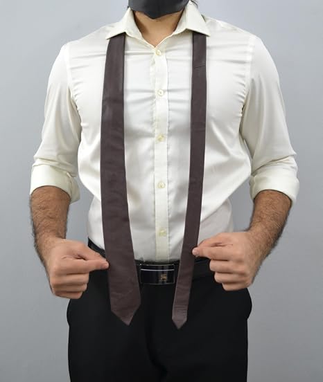 A man wearing a white long-sleeve button-up shirt, black trousers, and a dark brown wide tie, shown from the neck down against a plain gray background.
