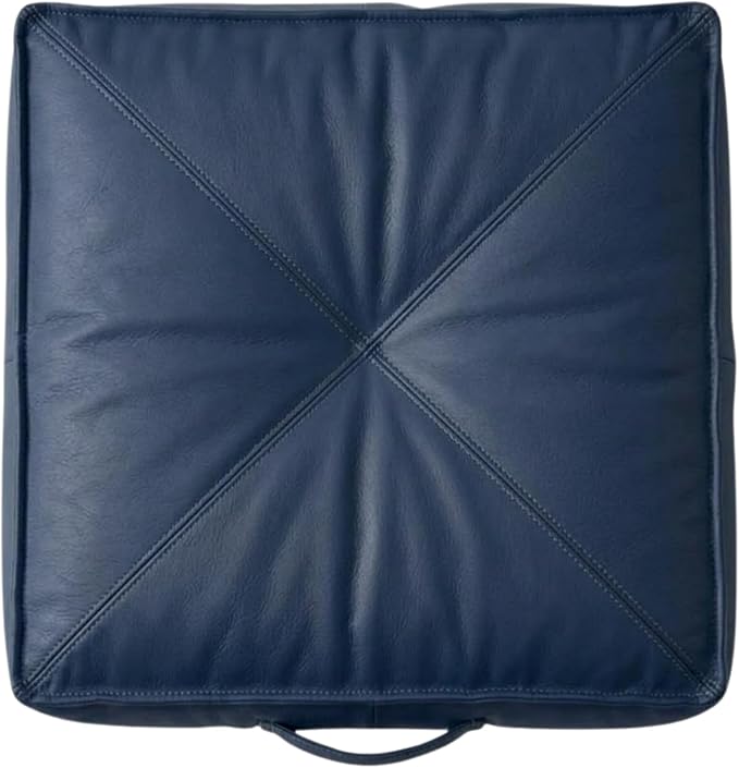 A square navy blue leather or -leather cushion with a diagonal stitched design radiating from the center and a small loop handle at the bottom, shown on a plain white background.