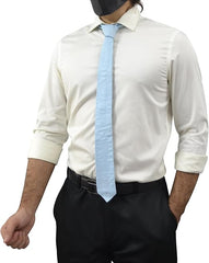 A man wearing a light blue necktie with a cream dress shirt and black trousers, shown from the neck down against a plain white background.