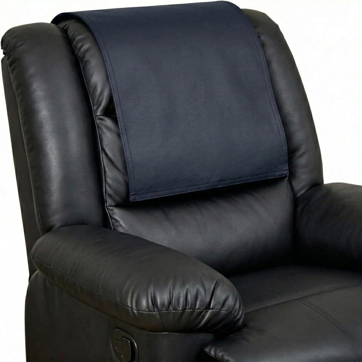A dark navy blue fabric chair cushion or backrest pad shown fitted over the headrest area of a black leather recliner chair against a plain white background.