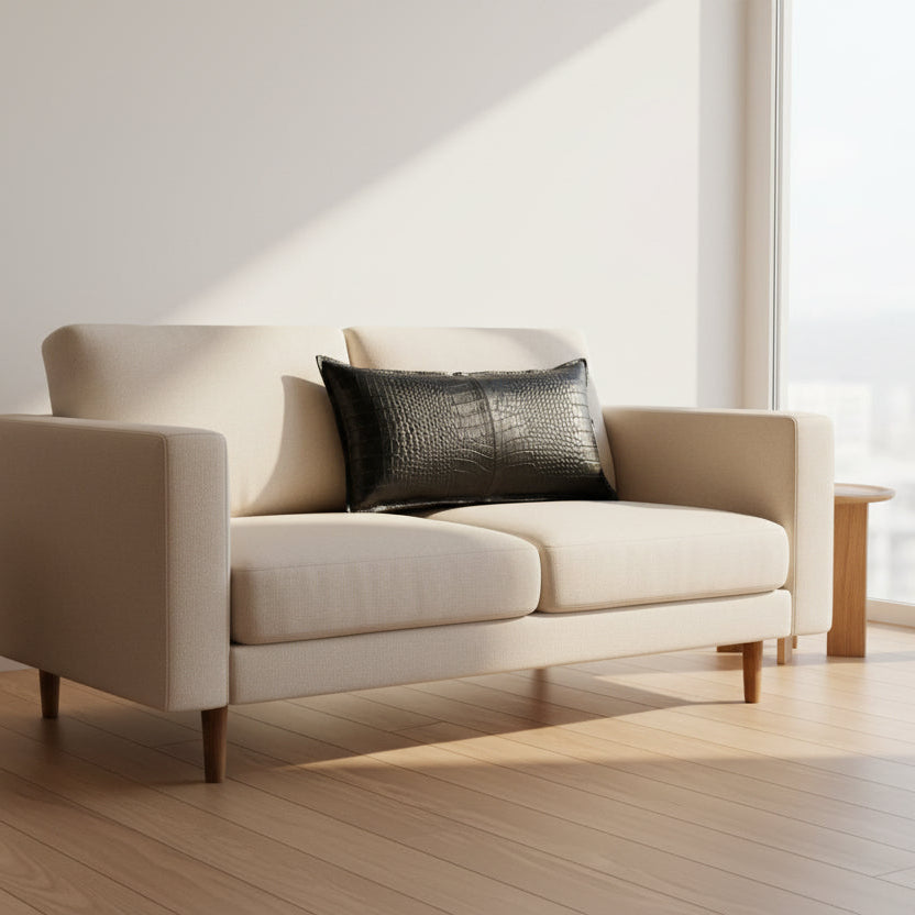 A rectangular black -crocodile leather lumbar pillow with a glossy textured finish, shown against a plain white background.