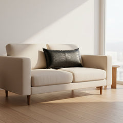 A rectangular black -crocodile leather lumbar pillow with a glossy textured finish, shown against a plain white background.
