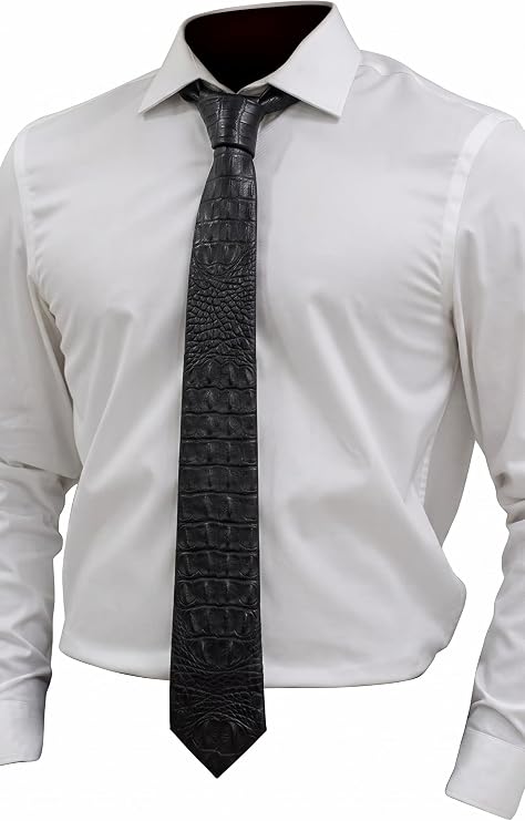 A black crocodile-embossed necktie styled on a white dress shirt, shown against a plain white background.