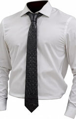 A black crocodile-embossed necktie styled on a white dress shirt, shown against a plain white background.