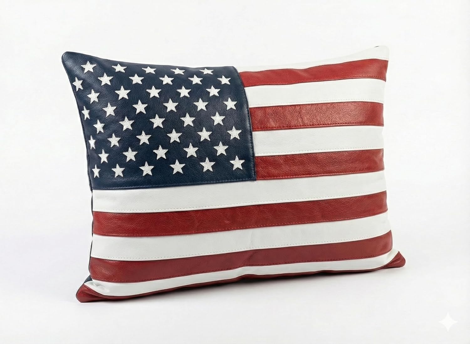 A rectangular throw pillow featuring a faux leather American flag design with a navy blue field of white stars and alternating red and white stripes, shown on a plain white background.