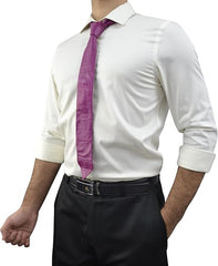A man wearing a white long-sleeve dress shirt, a purple necktie, and black dress pants, shown from the neck down against a plain white background.