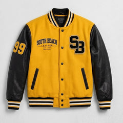 A yellow and black varsity-style jacket with black leather-look sleeves, featuring 'SOUTH BEACH LEATHER' and 'SB' embroidery on the front, and '99' on the right sleeve, shown against a light gray textured background.