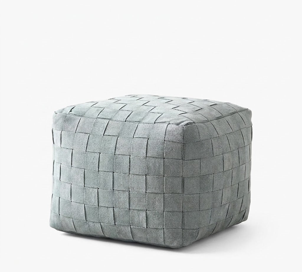 A square woven pouf ottoman in a muted gray-green tone, shown on a clean white background.