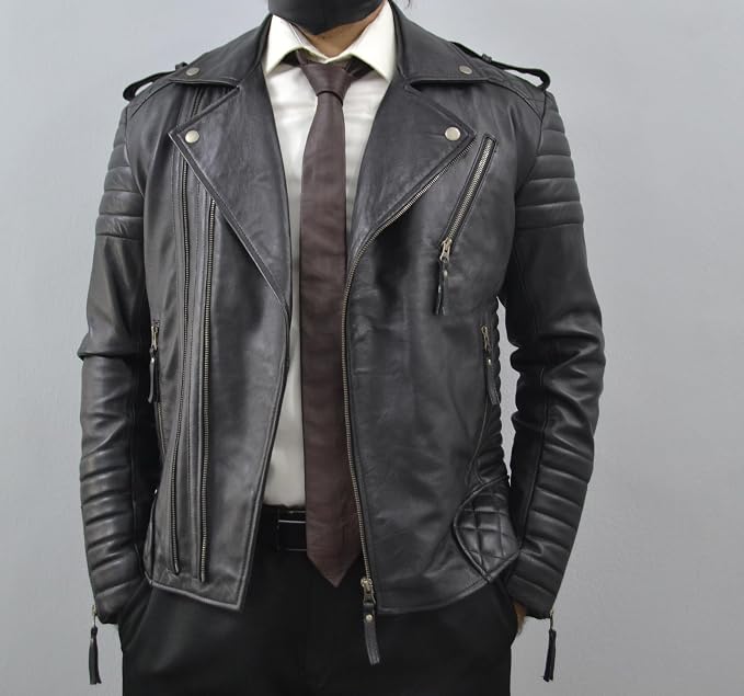 A black leather motorcycle jacket with silver zippers and quilted details, styled on a model wearing a white shirt, brown tie, and black pants against a gray background.