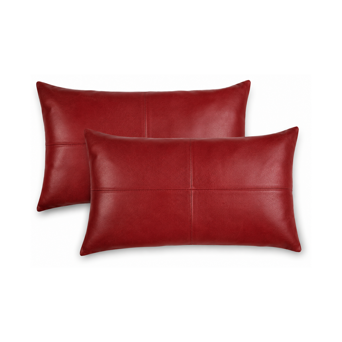 Two red leather pillows on a white background