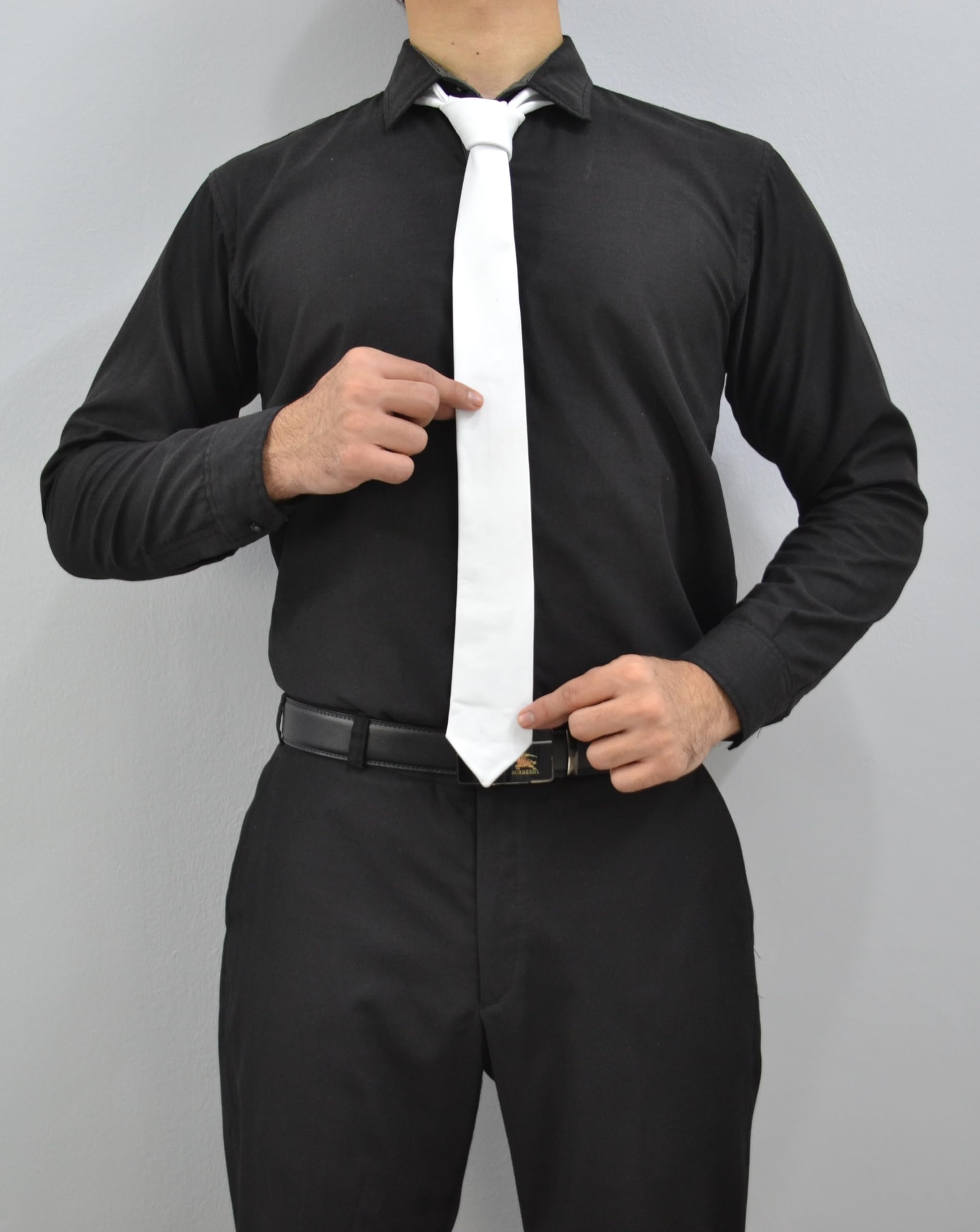 White leather necktie tied in a classic knot for formal occasions